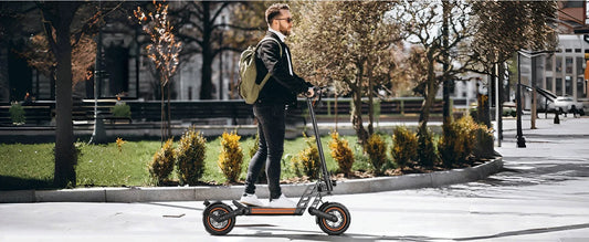TODIMART electric scooter rider commuting on a modern urban street