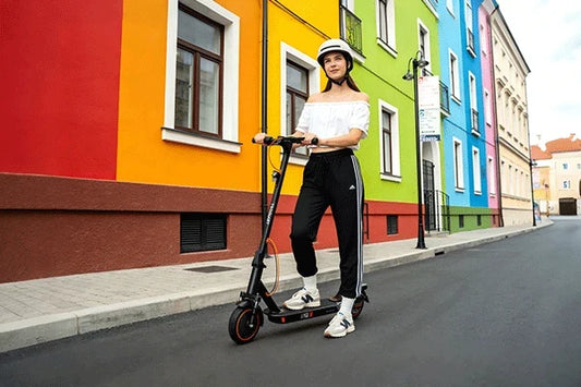 TODIMART electric scooter lifestyle scene with rider in an urban environment